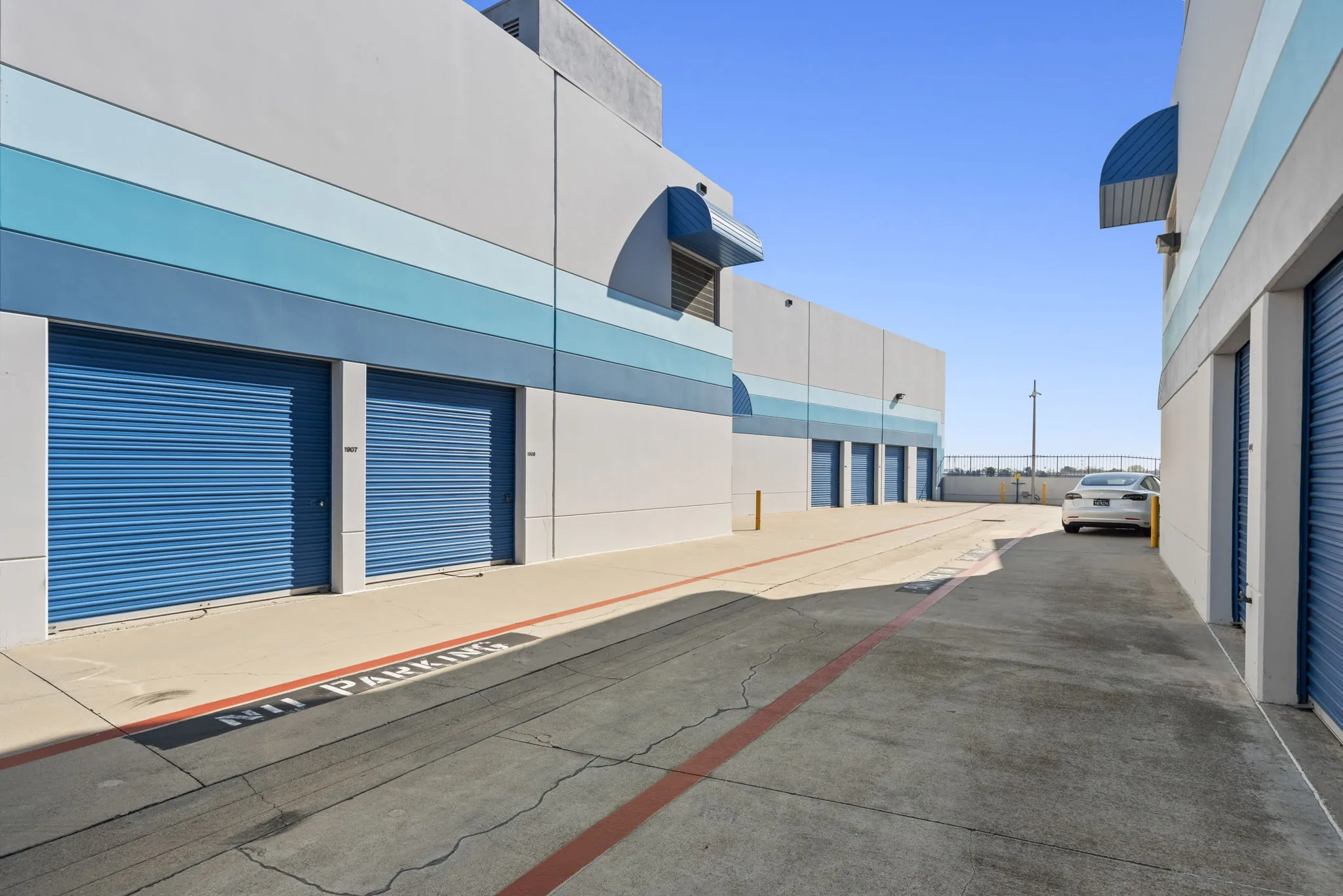 Broad driveway areas between storage units at Spencer Street Self Storage, Torrance, CA.
