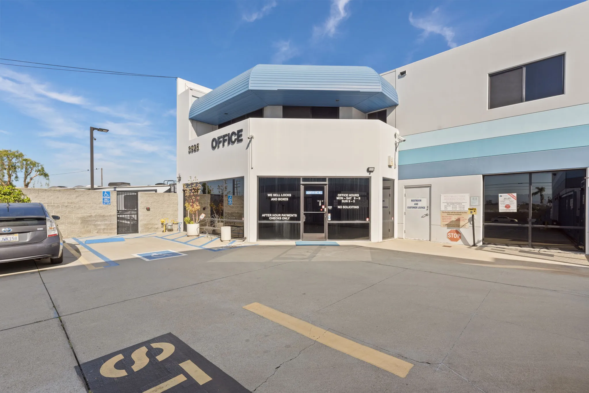 Office exterior with parking spaces at Spencer Street Self Storage, Torrance, CA.